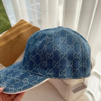 Blue Gucci monogram baseball cap with curved brim and front seam