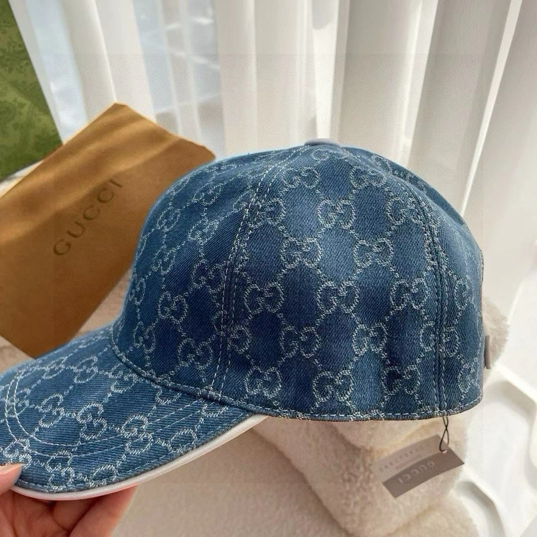 Blue Gucci monogram baseball cap with curved brim and front seam