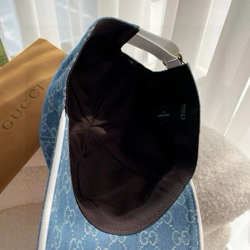 Blue cap with black interior lining and curved brim opening
