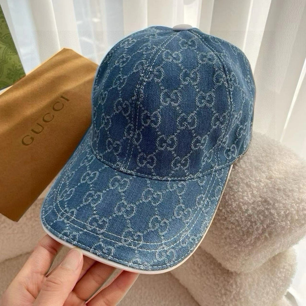 Blue Gucci monogram baseball cap, curved brim and top button detail