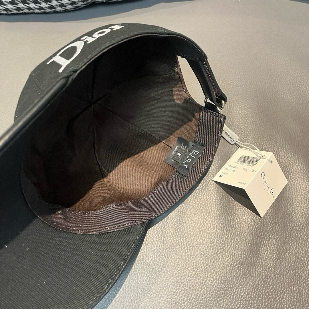 Black Dior cap interior view with fabric lining and attached size tag