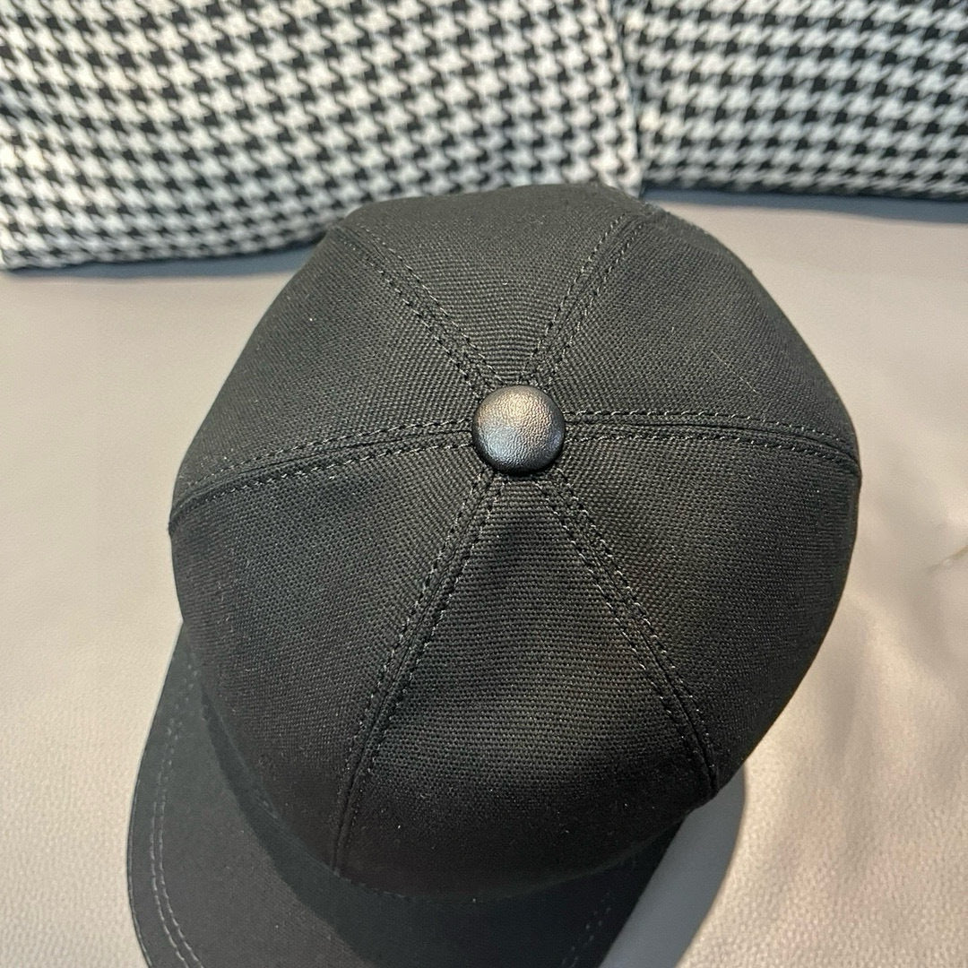 Black Dior cap top view with round button and stitched crown seams