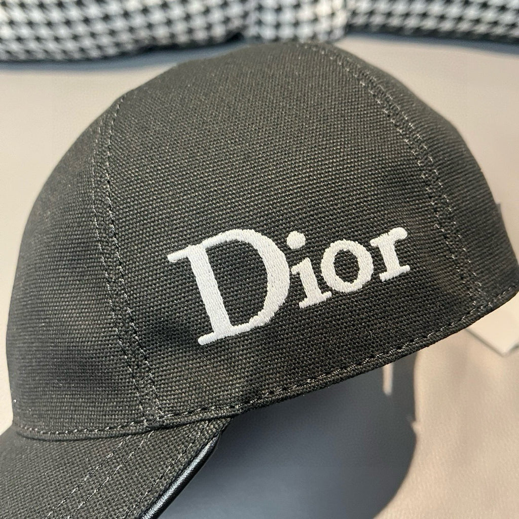 Black Dior cap close-up with white Dior logo on side panel