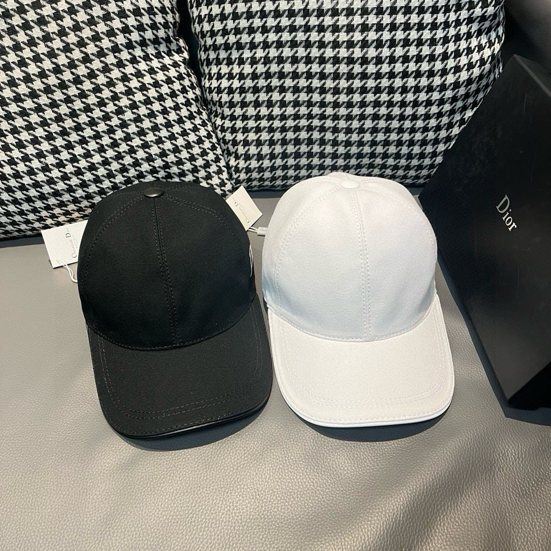 Pair of Dior caps: black and white baseball caps with curved brims