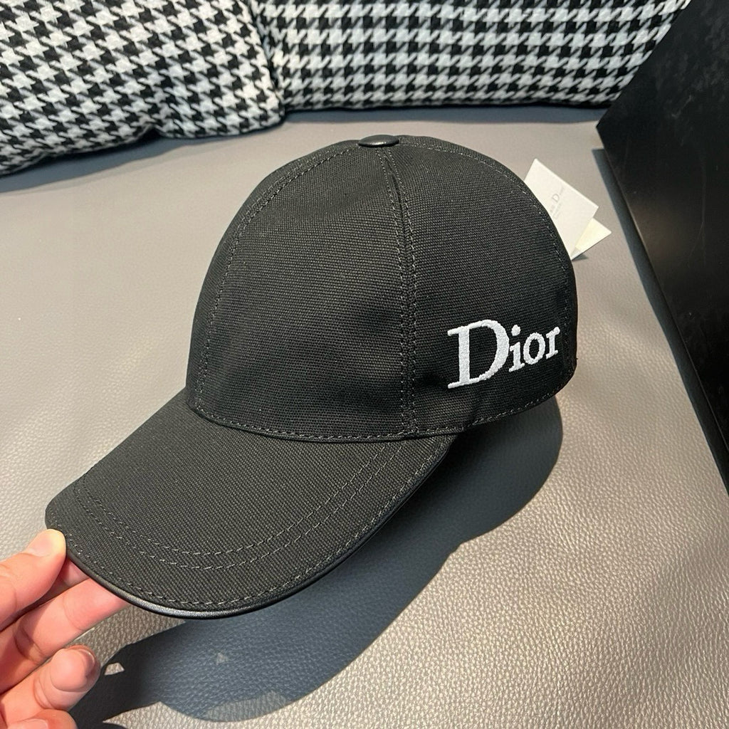 Black Dior cap with large white Dior logo on the front panel