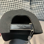 Black Dior cap interior with adjustable strap and metal clasp