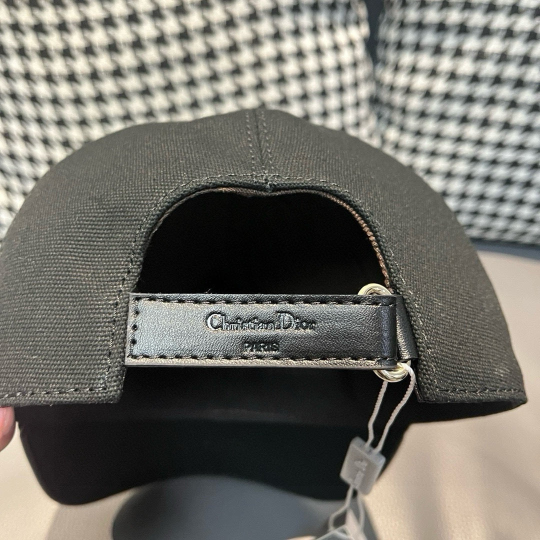 Black Dior cap interior with adjustable strap and metal clasp