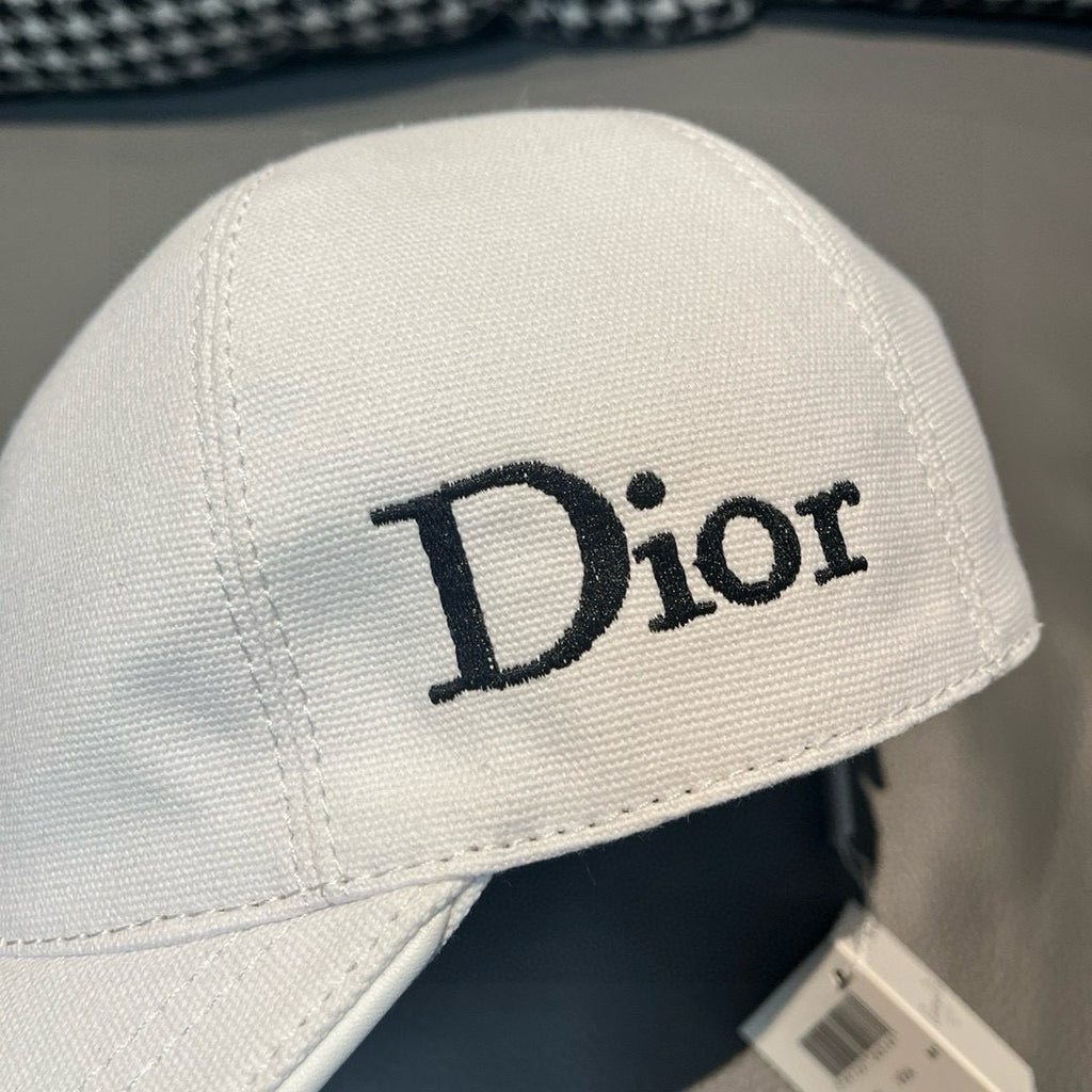 Dior cap in white canvas with large Dior logo on front.