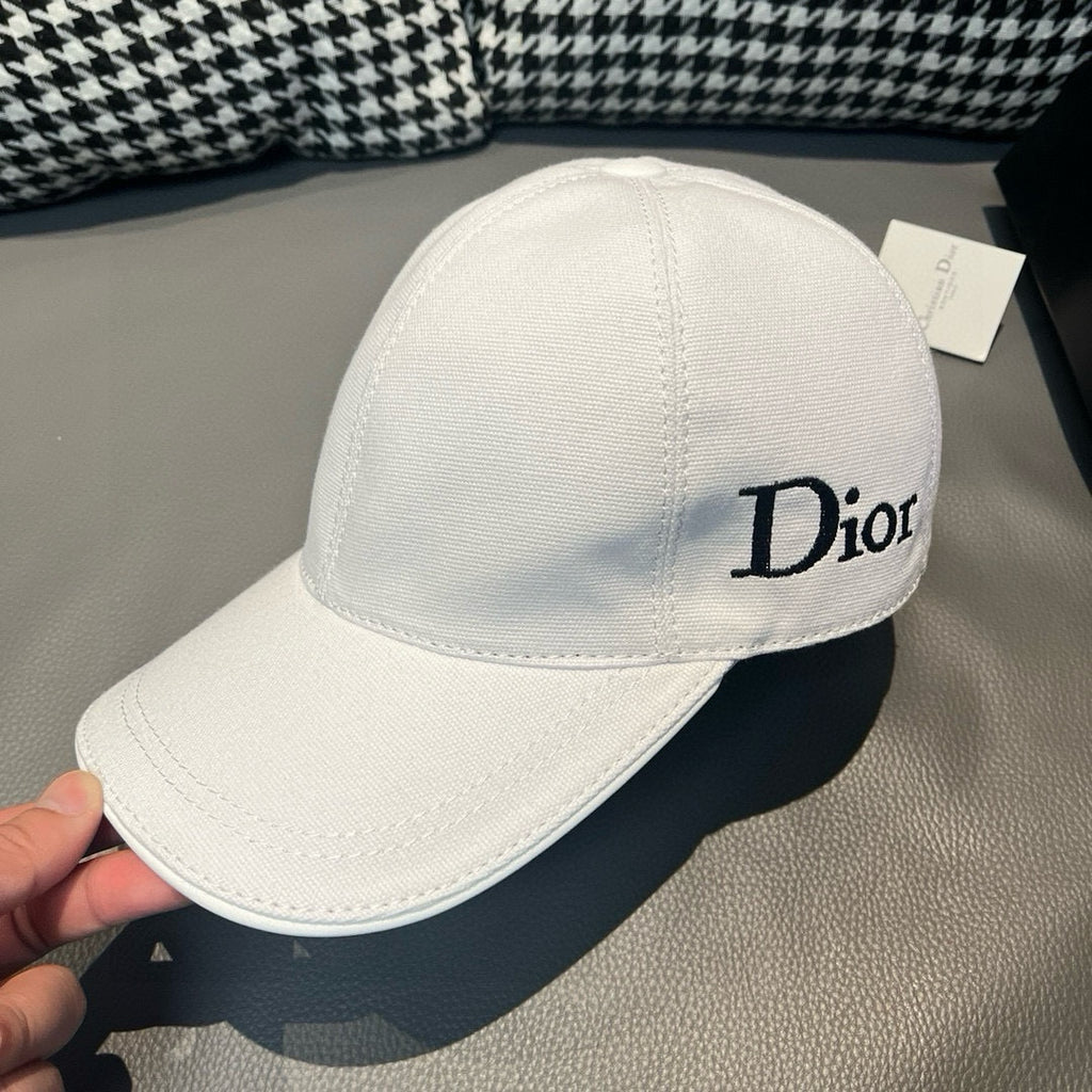 Dior cap in white canvas with Dior logo embroidery on the side.