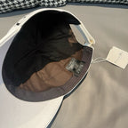 Dior cap in white canvas showing interior lining and adjustable strap.
