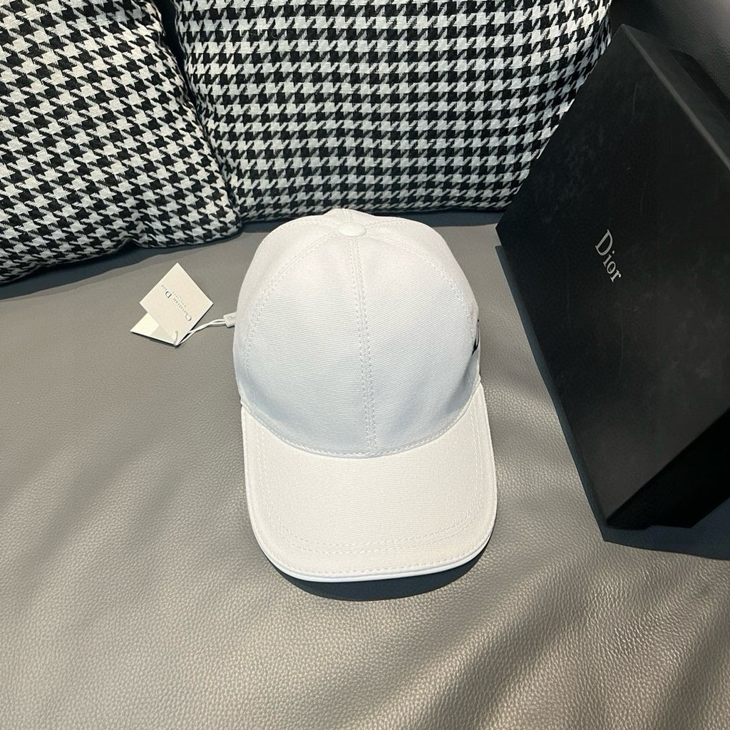 Dior cap in white canvas, back view with curved brim and small top button.