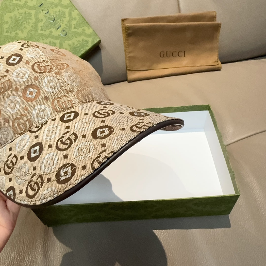 Tan monogram baseball cap with curved brim and stitched side panel detail