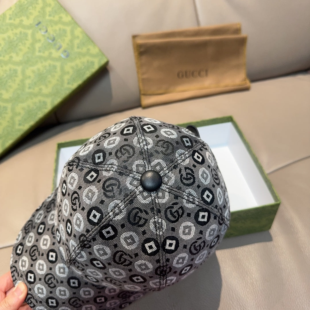 Gucci cap in dark gray with GG monogram pattern and round logo button on top