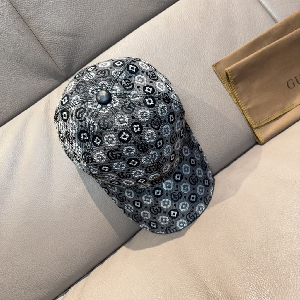 Gucci cap in dark gray with GG monogram pattern, domed top, and logo button