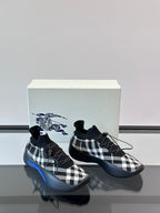 Burberry sneakers side view with black-and-white check pattern and blue sole