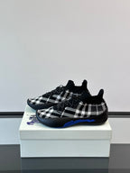 Burberry sneakers in black-and-white check with blue underlay detail on outsole