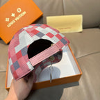 Louis Vuitton checkered cap with pink strap and interior opening
