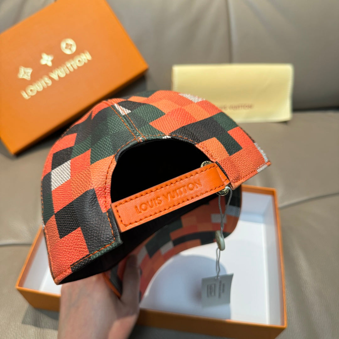Orange plaid baseball cap with black underside and tan leather brand patch