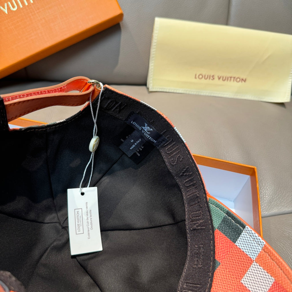 Baseball cap with black inner lining and orange plaid fabric panels