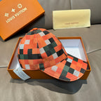 Plaid baseball cap in orange, green, black, and white with matching curved brim