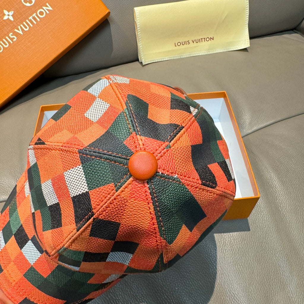 Plaid baseball cap with orange, green, black, and white crown and round button