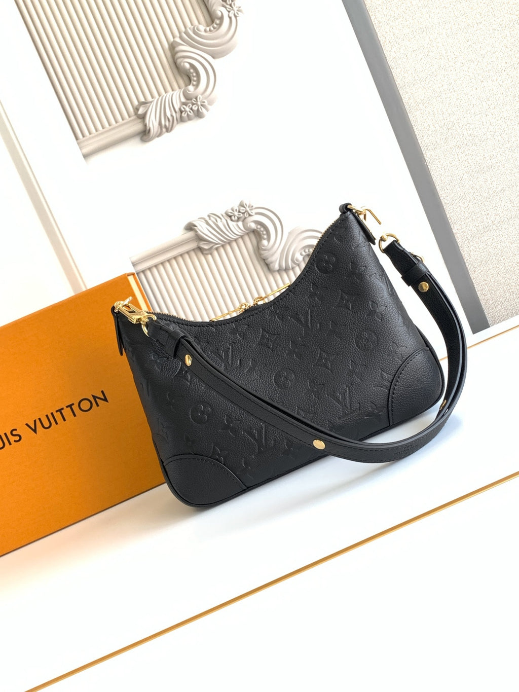 Louis Vuitton black monogram shoulder bag with gold hardware and leather shoulder strap