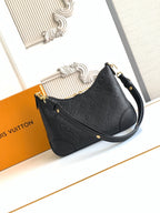 Louis Vuitton black monogram shoulder bag with gold hardware and leather shoulder strap
