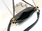 Louis Vuitton black monogram bag open view showing interior and gold zipper hardware