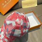 Red, white, and blue check print cap with round button detail