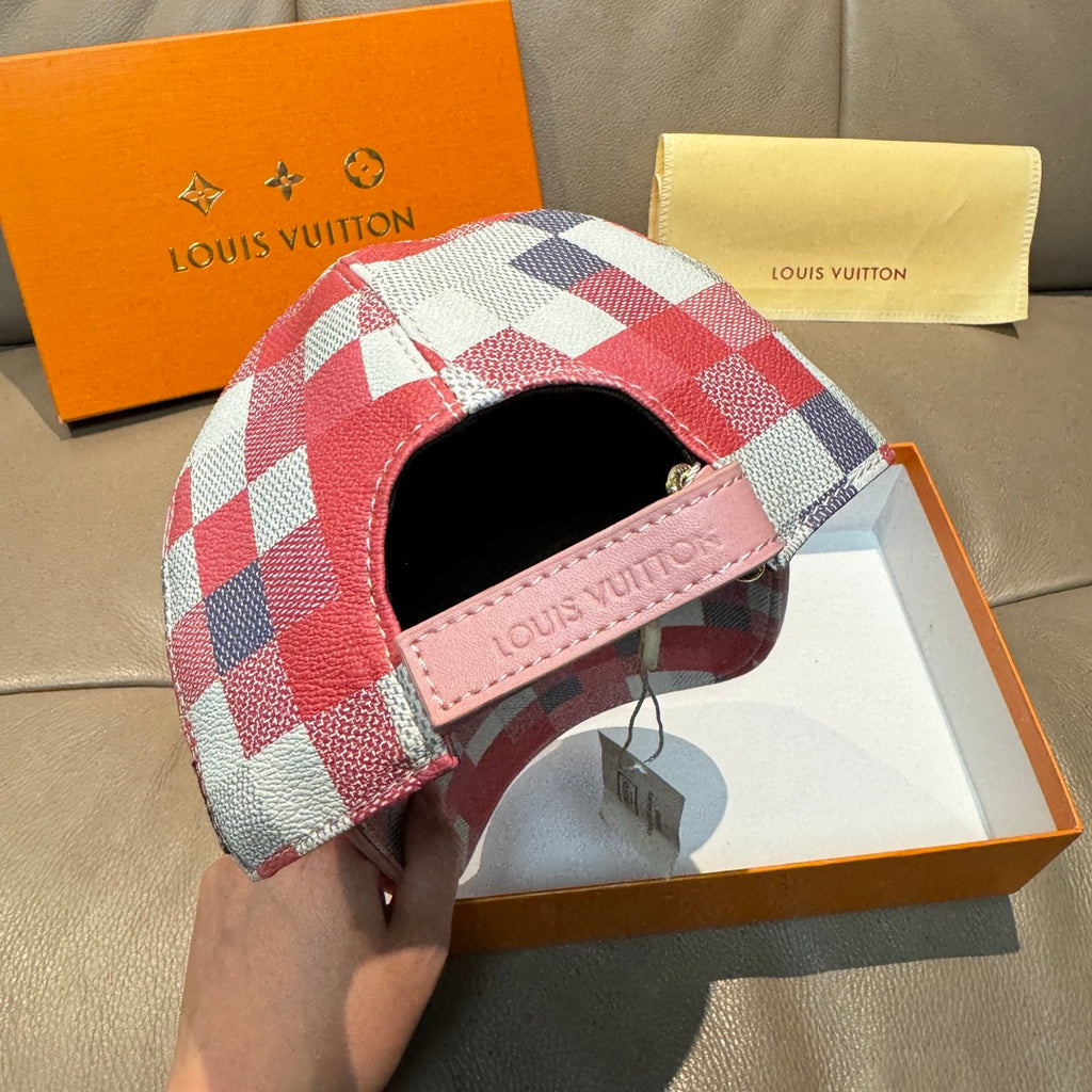 Red, white, and blue check print cap with pink leather brand patch