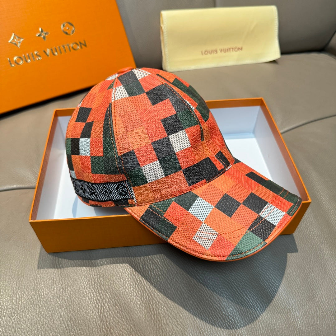 Louis Vuitton cap with geometric check pattern in orange, green, black, and white, back view.