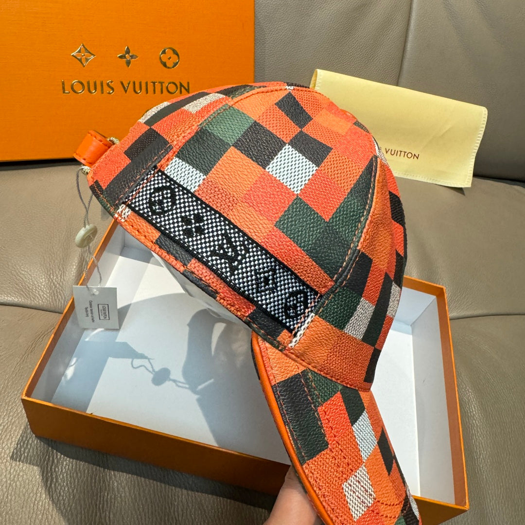 Louis Vuitton cap with orange, green, and black multicolor check design, strap and buckle detail.