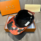 Louis Vuitton cap with black interior and multicolor geometric patchwork under brim edge.