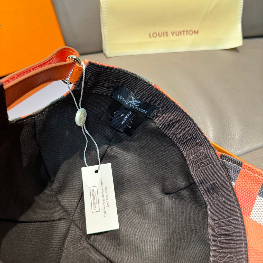 Louis Vuitton cap interior and strap with hang tags, showing dark lining and stitching.