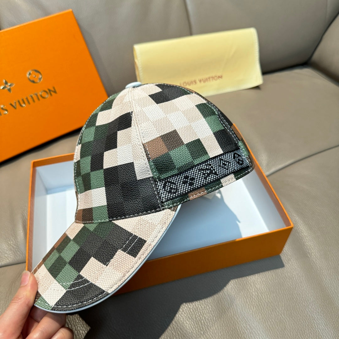 Louis Vuitton plaid baseball cap in cream, green, and brown squares with black accents