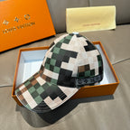 Louis Vuitton baseball cap with green, brown, and cream checkered pattern and curved brim