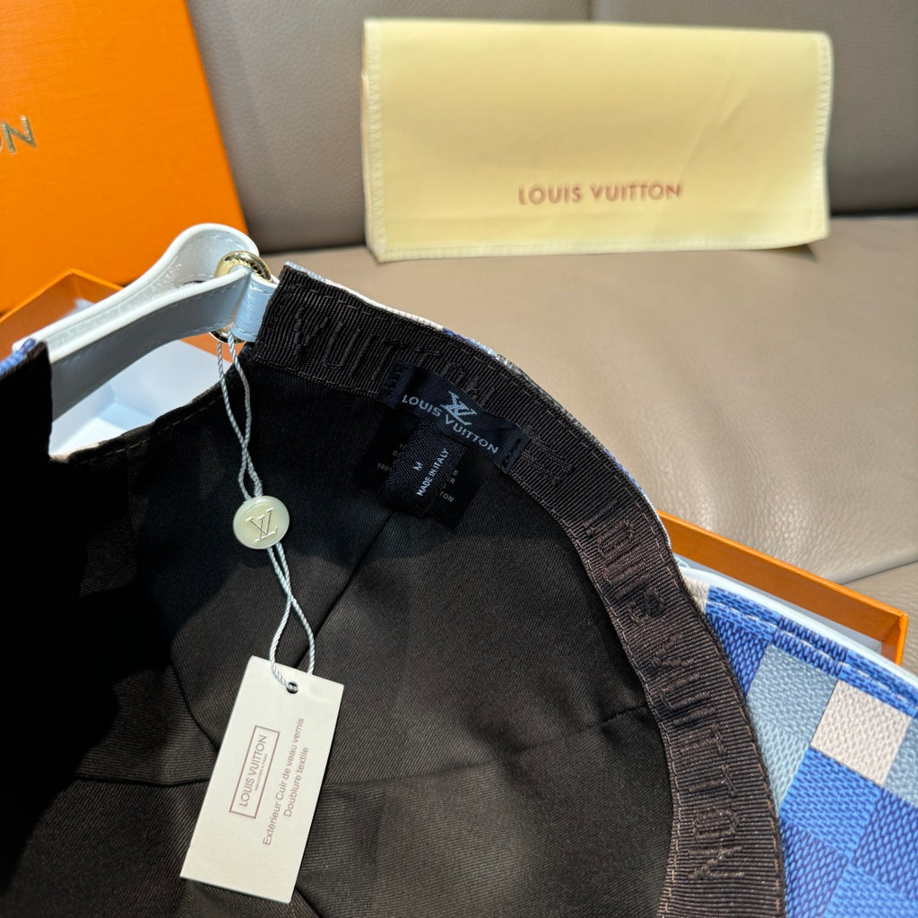 Louis Vuitton cap interior with black lining and adjustable strap, white hang tag.