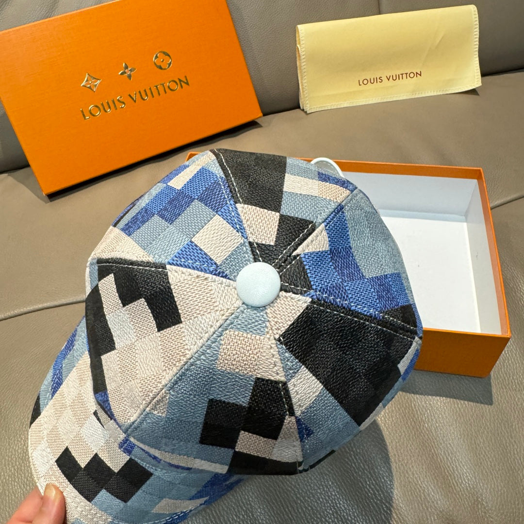 Louis Vuitton cap with blue, black, and white check pattern and round top button.