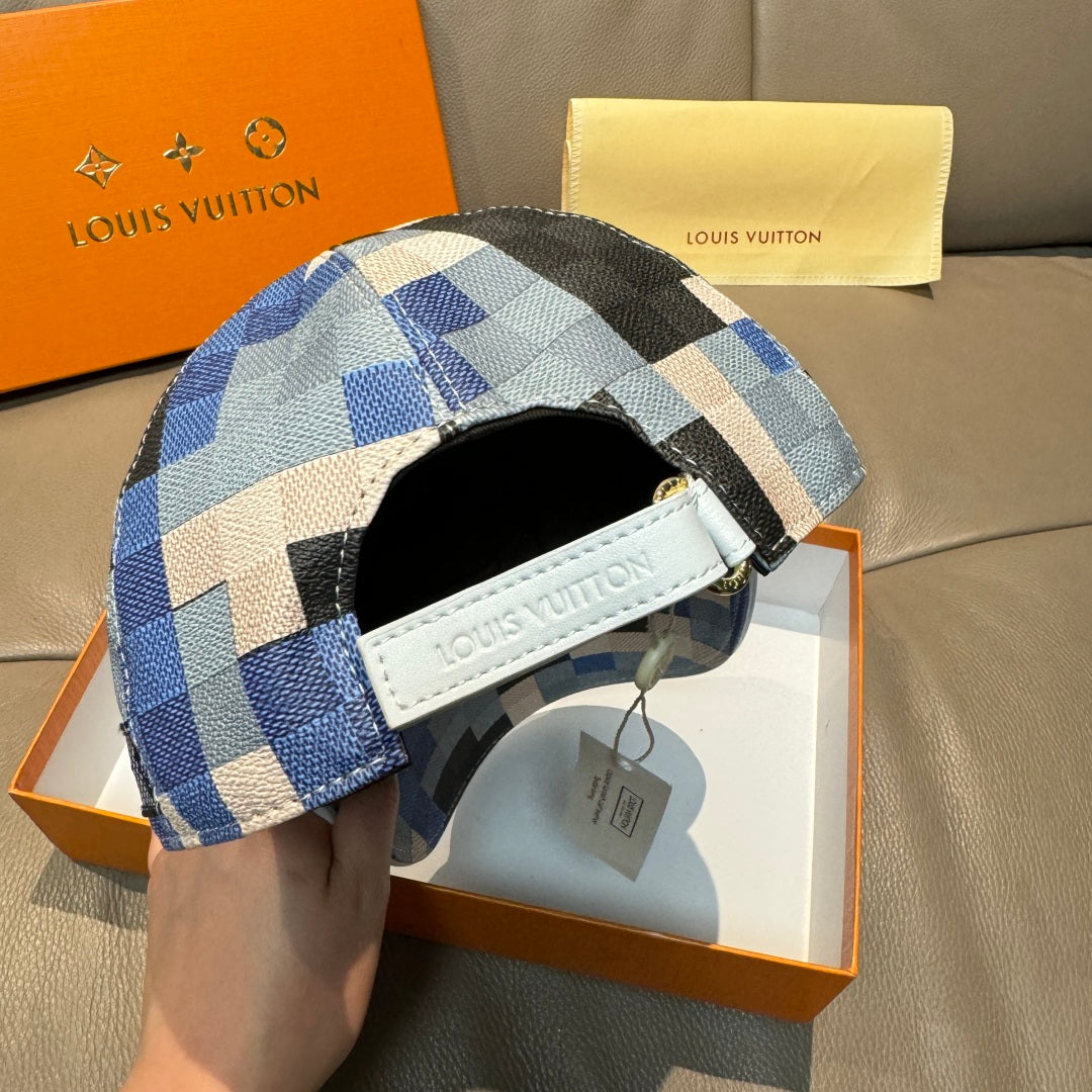 Louis Vuitton cap with blue, black, and white checkered side panel and white leather label.