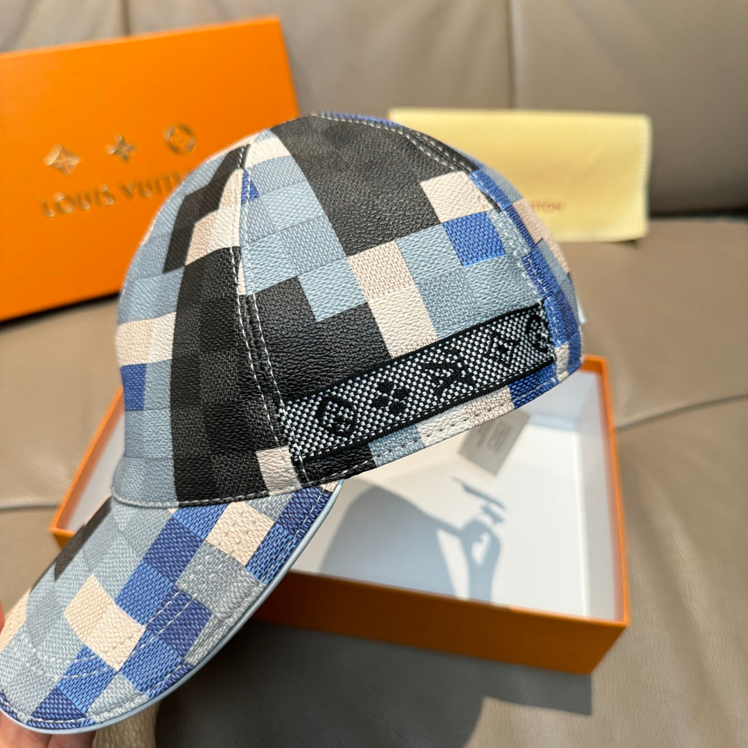 Louis Vuitton cap close-up with blue and black checkered fabric and textured brim edge.