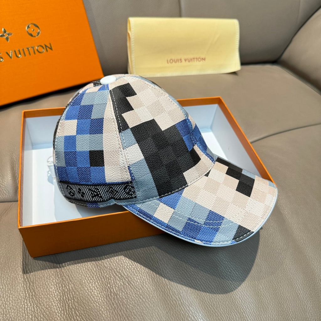 Louis Vuitton cap with blue, black, and white checkered panels and curved brim.