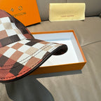 Louis Vuitton cap side view with red and white check pattern and contrast brim edge