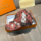 Louis Vuitton cap with red and black check design, curved brim, and adjustable strap