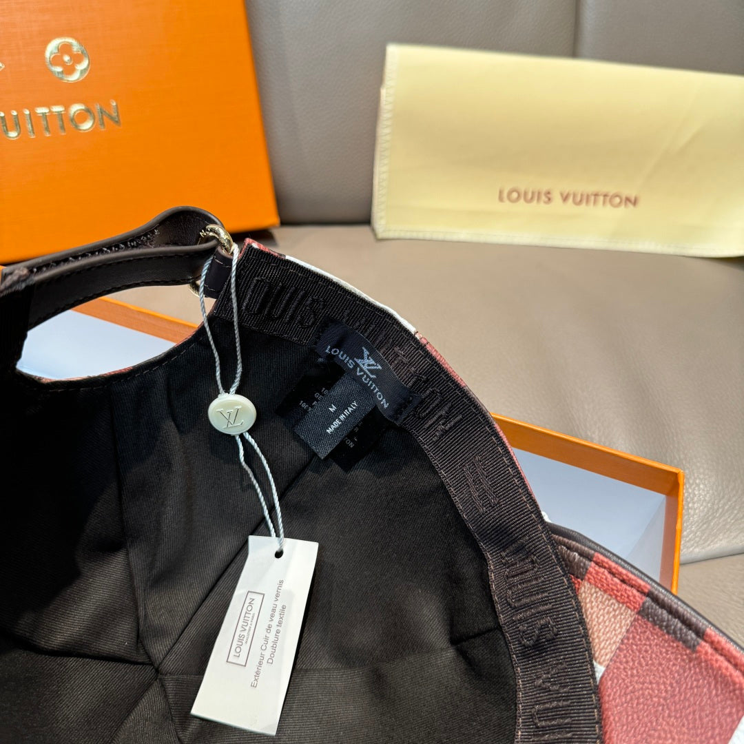Louis Vuitton cap with black strap and hanging tag on the side