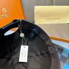Louis Vuitton cap with dark interior lining and patterned underbrim, hanging price tags