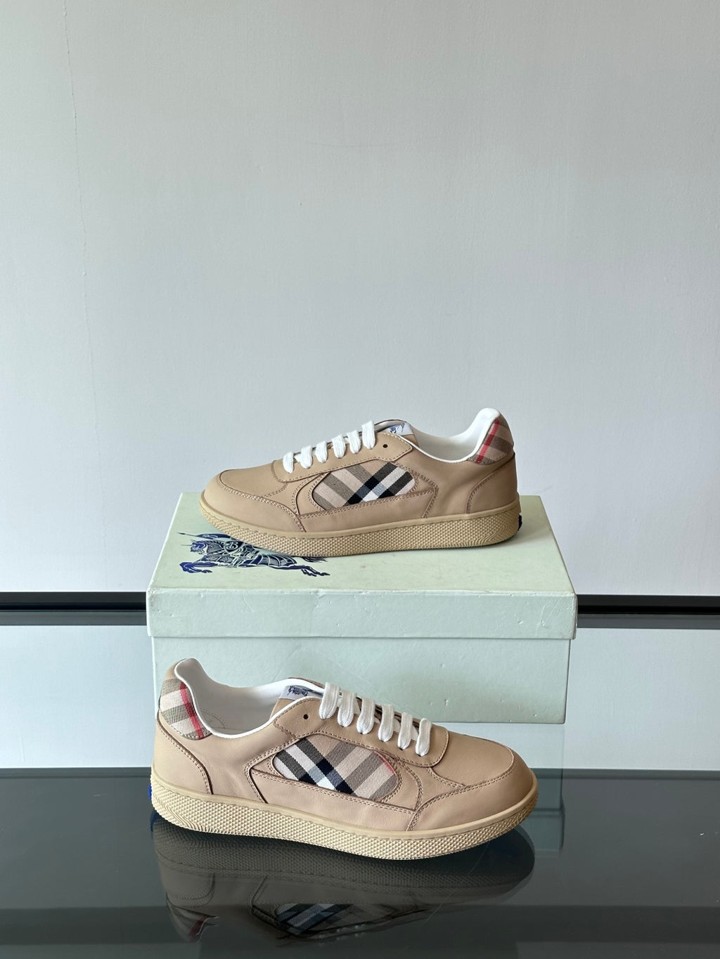 Beige low-top sneakers, white laces, Burberry check panel on outer side