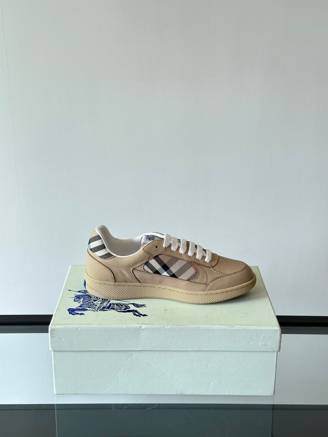 Single beige low-top sneaker with white laces and Burberry check side stripe