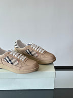 Beige low-top sneakers side view, white laces, Burberry check stripe on each shoe