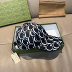 Gucci cap with black-and-white GG pattern and stitched curved brim