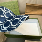 Gucci cap brim in navy with white GG monogram, angled view.